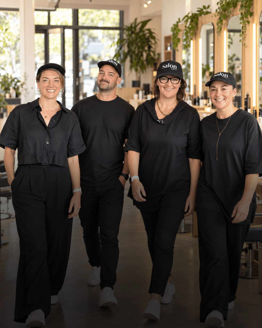 Larissa and the Salon Owners Collective team walking through a salon
